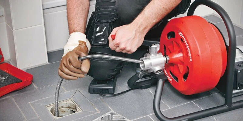 Drain cleaning service in Sarasota, Florida using professional plumbing equipment